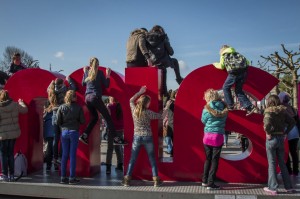 Children playing on "Amsterdam" in front of the Rijksmuseum