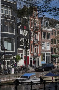 Leaning houses alongside canal